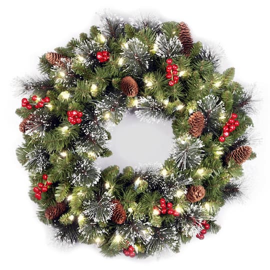 24" Crestwood® Spruce Wreath with Silver Bristle, Pine Cones, Red Berries & Glitter with Warm White LED Lights